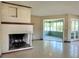 Bright living room with a brick fireplace and a sunroom at 3503 Casablanca Ave, St Pete Beach, FL 33706