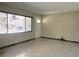 Bright living room with a large window and light walls at 3503 Casablanca Ave, St Pete Beach, FL 33706
