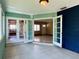 Inviting sunroom with french doors leading to the living room at 3503 Casablanca Ave, St Pete Beach, FL 33706