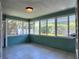 Sunroom with tile floor and light blue walls at 3503 Casablanca Ave, St Pete Beach, FL 33706