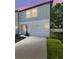 A modern two-story townhome with a one car garage and a well maintained lawn at 4326 Banjo Lake Rd, Land O Lakes, FL 34639