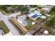 Aerial view of fenced yard, black driveway, and modern design elements at 4601 71St N Ave, Pinellas Park, FL 33781