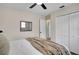 Inviting bedroom featuring a ceiling fan, wood floors, a closet and an ensuite bathroom at 4601 71St N Ave, Pinellas Park, FL 33781