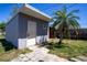 Backyard building with white door, small window and palm tree at 4601 71St N Ave, Pinellas Park, FL 33781