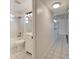 Well-lit bathroom featuring tile flooring, a shower-tub combination, and a modern vanity at 513 E Langford Dr, Plant City, FL 33563