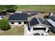 Aerial shot showcasing a house with solar panels, and an attached two car garage at 520 Oak Creek Dr, Brandon, FL 33511