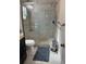 Clean bathroom featuring glass-enclosed shower, toilet, tiled floor, and vanity at 520 Oak Creek Dr, Brandon, FL 33511