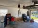 Spacious garage with exposed insulation with interior and exterior storage at 520 Oak Creek Dr, Brandon, FL 33511