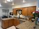 Well-lit kitchen featuring granite countertops, stainless steel appliances, and custom cabinetry at 520 Oak Creek Dr, Brandon, FL 33511