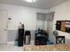 Kitchen featuring granite countertops, tile floors, grey walls, and a bar area at 520 Oak Creek Dr, Brandon, FL 33511
