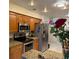 Updated kitchen features stainless steel appliances, granite countertops, and modern lighting at 520 Oak Creek Dr, Brandon, FL 33511