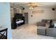 Spacious living room with stylish wood accent wall, neutral colors, and tile flooring at 520 Oak Creek Dr, Brandon, FL 33511