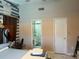 The main bedroom includes a decorative accent wall and an ensuite bathroom with a shower at 520 Oak Creek Dr, Brandon, FL 33511