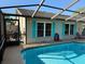 Enclosed pool area features turquoise shutters, anchor accent, and a tranquil swimming space at 520 Oak Creek Dr, Brandon, FL 33511