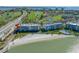 Aerial of condo by the beach, a pool, a golf course and bay waters, showing a desirable coastal lifestyle at 5701 Bahia Del Mar Cir # 408, St Petersburg, FL 33715
