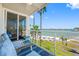 Balcony with comfortable seating and great views of the beach, water, and bridge at 5701 Bahia Del Mar Cir # 408, St Petersburg, FL 33715