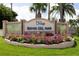 Community sign with lush flowerbeds and tropical landscaping welcome residents and visitors to Bahia Del Mar at 5701 Bahia Del Mar Cir # 408, St Petersburg, FL 33715