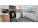 Modern kitchen with stainless steel appliances, grey countertops, and stylish backsplash at 5701 Bahia Del Mar Cir # 408, St Petersburg, FL 33715