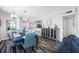Open concept dining and living space with comfortable seating and dining set at 5701 Bahia Del Mar Cir # 408, St Petersburg, FL 33715