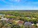 Beautiful aerial shot of a neighborhood with scenic views, lush greenery, and well-maintained homes at 6130 Kestrelridge Dr, Lithia, FL 33547