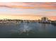 Water view from a condominium features fountains and palm trees along the banks of the community at 6277 Bahia Del Mar Blvd # 210, St Petersburg, FL 33715