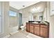 Full bathroom with neutral paint, tile flooring, granite counters, wood cabinet and shower-tub combo at 6324 Brevada Ln, Apollo Beach, FL 33572