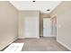 Bright bedroom featuring neutral paint, carpet, baseboards, a ceiling fan, and closet with folding doors at 6324 Brevada Ln, Apollo Beach, FL 33572