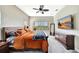 Bedroom with a king-size bed, TV, dresser and ceiling fan at 6324 Brevada Ln, Apollo Beach, FL 33572