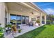 Covered patio with sliding glass doors, a ceiling fan, and a view of the pond at 6324 Brevada Ln, Apollo Beach, FL 33572
