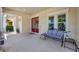 Cozy front porch with a bench, perfect for relaxing and enjoying the neighborhood at 6324 Brevada Ln, Apollo Beach, FL 33572