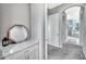 Hallway featuring an octagon mirror and a view of the main bath area at 6324 Brevada Ln, Apollo Beach, FL 33572