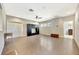 Spacious living room featuring tile floors, ceiling fan, and built in entertainment center at 6324 Brevada Ln, Apollo Beach, FL 33572