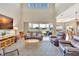 Expansive living room connects to the kitchen with views of the tranquil waterfront at 6324 Brevada Ln, Apollo Beach, FL 33572