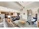Large living room with a staircase leading upstairs, seamlessly connecting to the kitchen at 6324 Brevada Ln, Apollo Beach, FL 33572