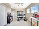 Office area featuring neutral paint, carpeting, a ceiling fan, and natural light from a large window at 6324 Brevada Ln, Apollo Beach, FL 33572