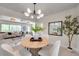 Charming dining area showcasing an open layout and views of the modern living room at 6632 23Rd S St, St Petersburg, FL 33712