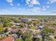 Scenic aerial view of residential area with mature trees and nearby commercial building at 6680 67Th N Way, Pinellas Park, FL 33781