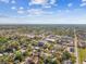 Expansive aerial shot shows residential homes, commercial buildings, and cityscapes in the distance at 6680 67Th N Way, Pinellas Park, FL 33781