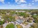 Neighborhood aerial view, showcasing mature trees, blue skies, and well-maintained homes at 6680 67Th N Way, Pinellas Park, FL 33781