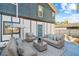 Back patio with seating including chairs, sofas, pillows, and outdoor decor at 6680 67Th N Way, Pinellas Park, FL 33781