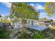 Backyard with a patio, native plants, manicured lawn, privacy fence, and seating at 6680 67Th N Way, Pinellas Park, FL 33781