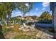 Backyard featuring a fire pit, chairs, hammock, and partial fencing at 6680 67Th N Way, Pinellas Park, FL 33781