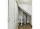 Small bathroom space featuring a toilet and a water heater in an unfinished space at 6680 67Th N Way, Pinellas Park, FL 33781