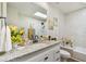 Upgraded bathroom with granite vanity, marble wall tile, tub, and a skylight at 6680 67Th N Way, Pinellas Park, FL 33781