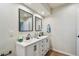 Modern bathroom featuring dual sinks, stylish mirrors, and updated fixtures at 6680 67Th N Way, Pinellas Park, FL 33781