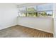 Bright bedroom with hardwood floors and large window at 6680 67Th N Way, Pinellas Park, FL 33781