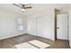 A lovely bedroom boasts new floors, a ceiling fan, and a closet for ample storage at 6680 67Th N Way, Pinellas Park, FL 33781