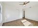 A spacious bedroom offers modern flooring, a fan, and a closet with a doorway at 6680 67Th N Way, Pinellas Park, FL 33781