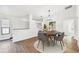 Dining room featuring hardwood floors, modern chandelier, and neutral colors at 6680 67Th N Way, Pinellas Park, FL 33781