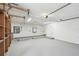 A clean garage area featuring shelving, ample room for vehicles and storage at 6680 67Th N Way, Pinellas Park, FL 33781